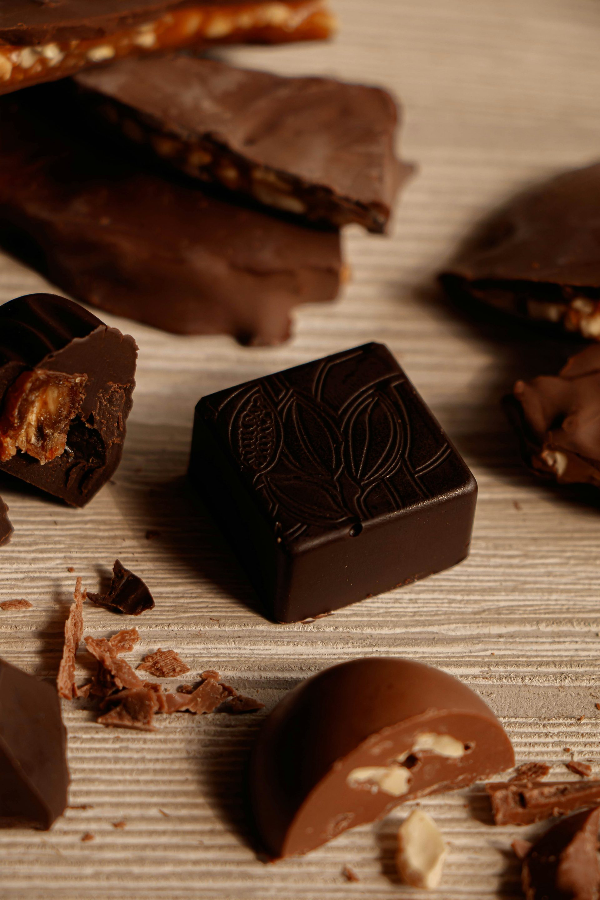 a close up of a chocolate bar and pieces of chocolate